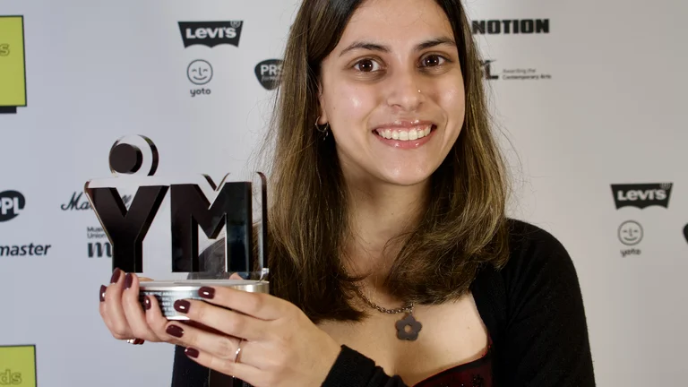 talia andrea holds her youth music award