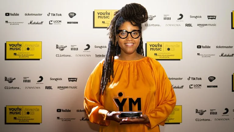 ni maxine holds her youth music award