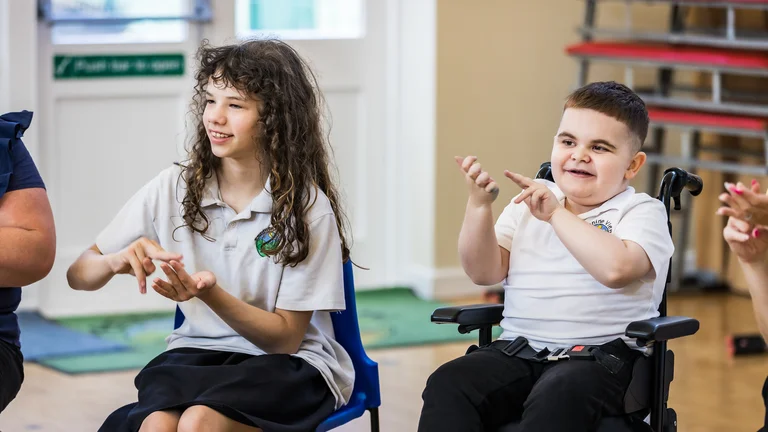 Two children tapping their fingers 