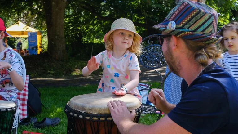 Small child playing drums