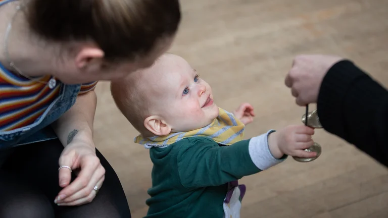 baby grabbing an instrument