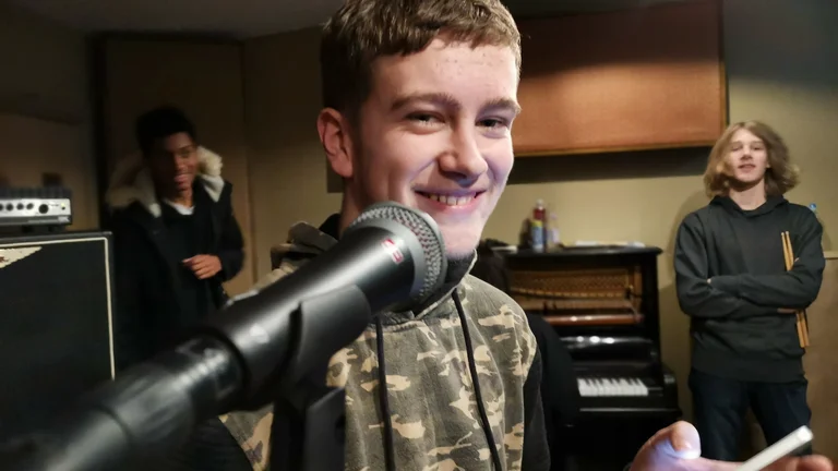 Young person in front of mic