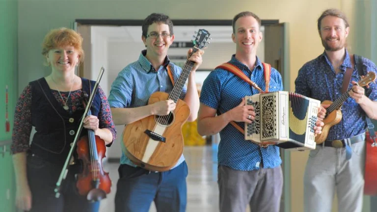 The team holding their instruments 