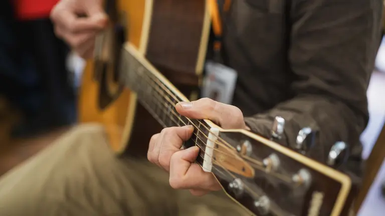 Close up on a guitar being played