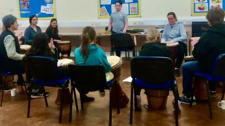 A group of children drumming