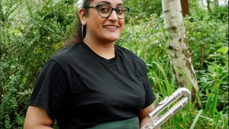 Dr Diljeet Kaur Bhachu holds a flute
