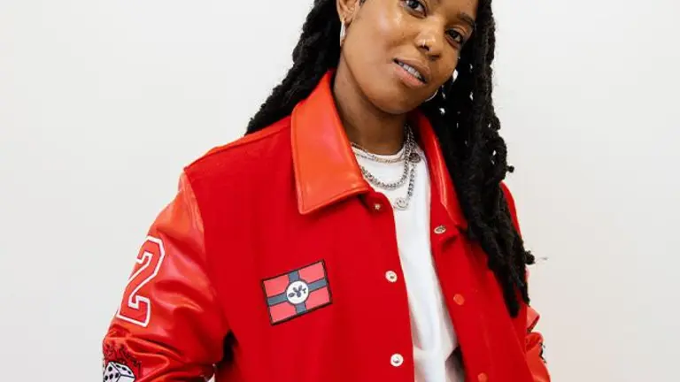 jordss wears a red jacket