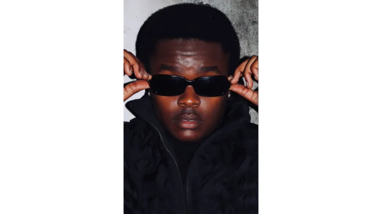 kfromkway holds the sides of his black sunglasses