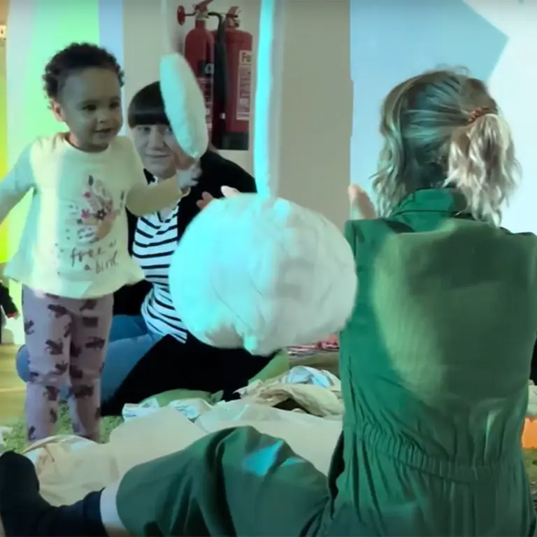 Child taking part in a sensory project at Magic Acorns